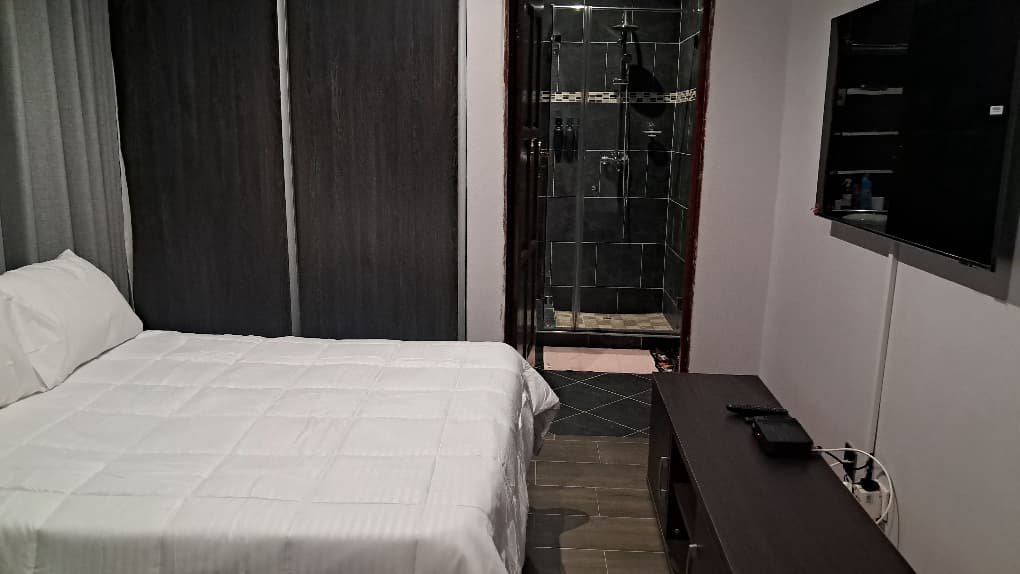 Comfortable bedroom in a self-catering cottage at our guest house in Masvingo.