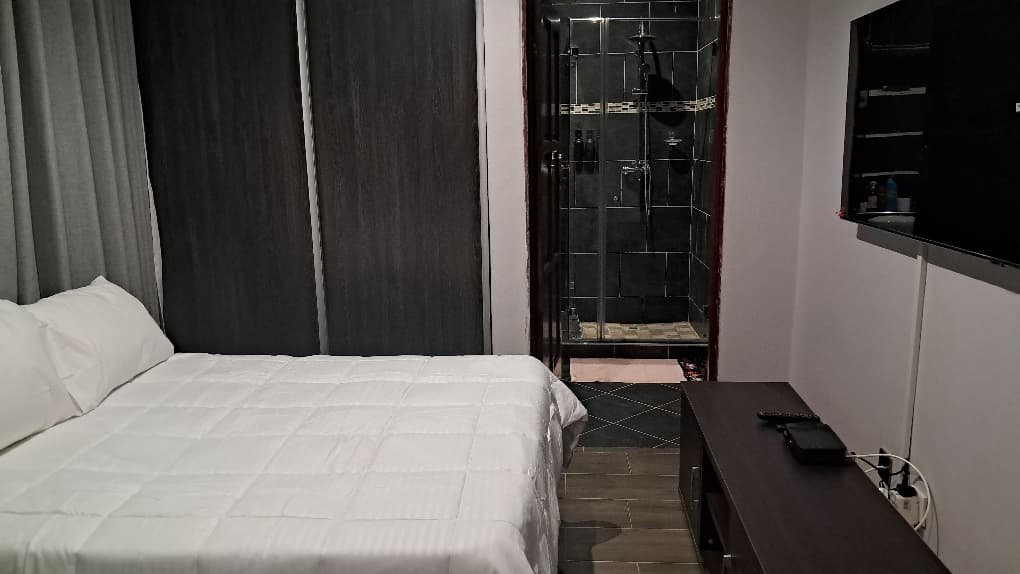 Comfortable bedroom in a self-catering cottage at our guest house in Masvingo.